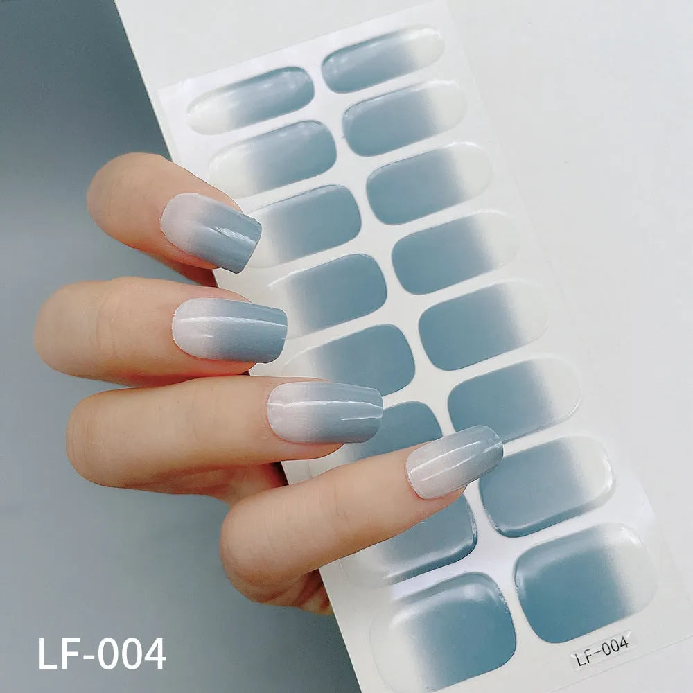 Full nail art sticker sheet showing 16 different solid colour designs including European simple nails and floral patterns