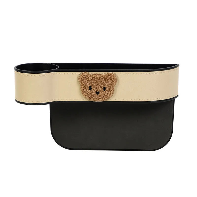 Leather car seat gap storage box with cartoon bear design hanging between vehicle front seats