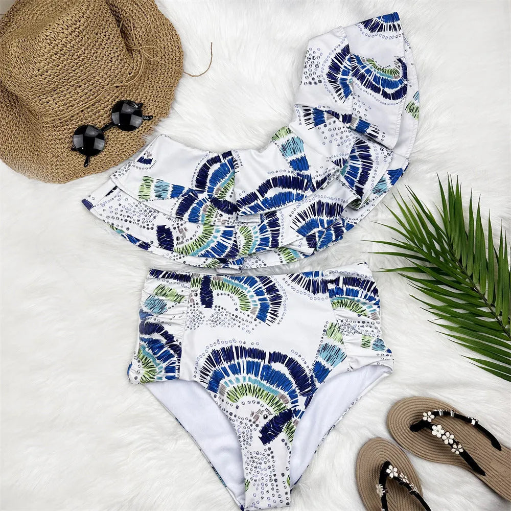 White women's one-shoulder bikini swimsuit with lotus leaf detail and split design