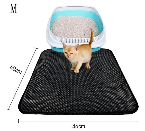 Double layer EVA cat litter mat in black with textured surface, placed under a litter box to trap debris