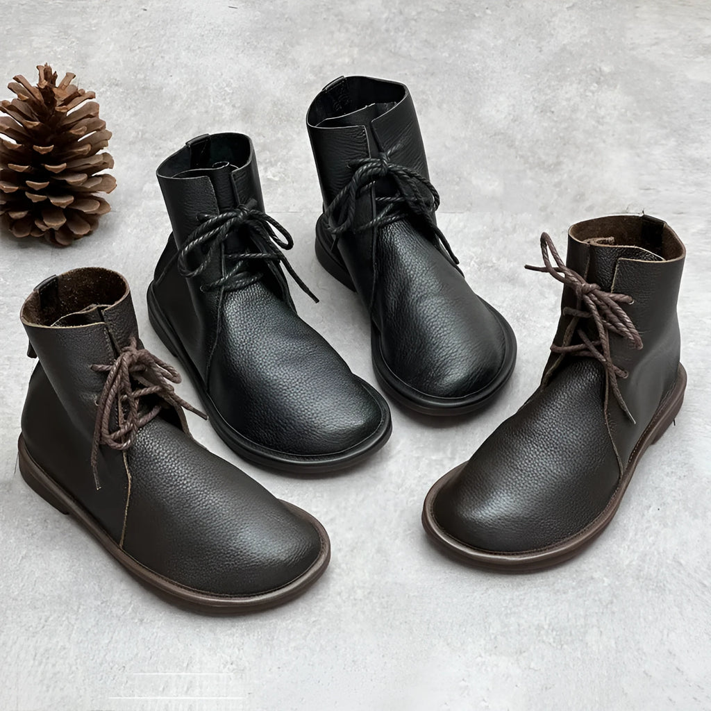 Retro genuine leather Martin boots for women in black, flat heel, round toe, front tie strap.