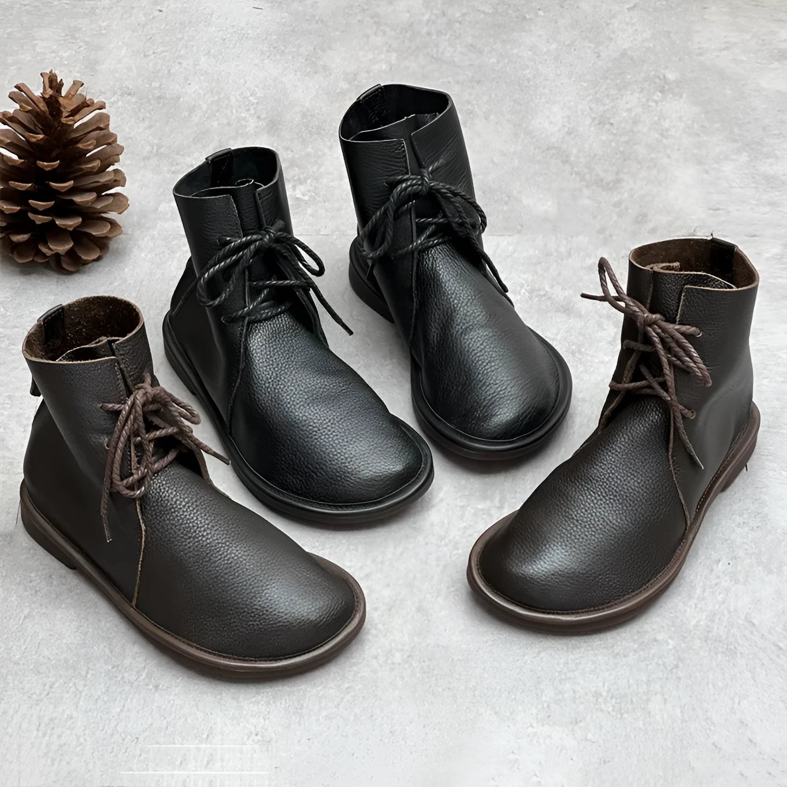 Retro genuine leather Martin boots for women in black, flat heel, round toe, front tie strap.