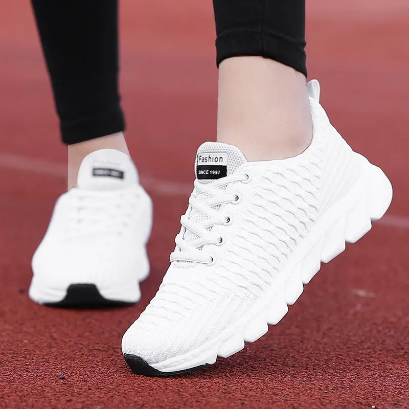 Women's running shoes in black pink white colours with fly weaving upper and wear-resistant outsole