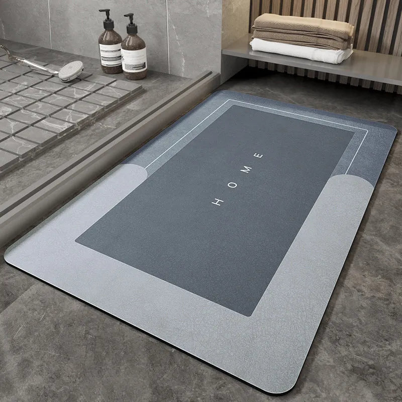 Blended fabric bathroom floor mat in blue colour, shown in an oval shape on a tiled floor.