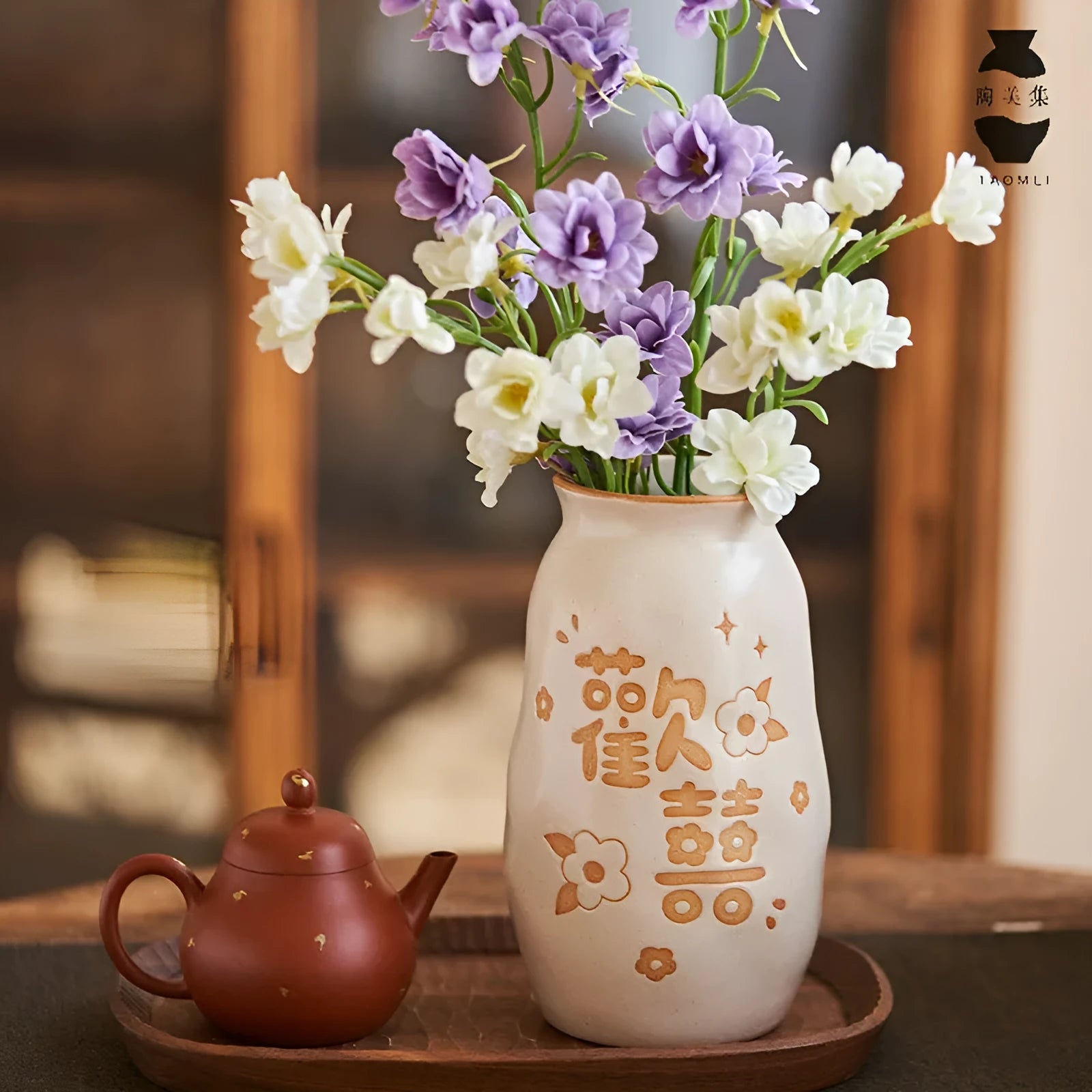 Chinese hand-painted ceramic vase with persimmon fruit designs on wooden desktop