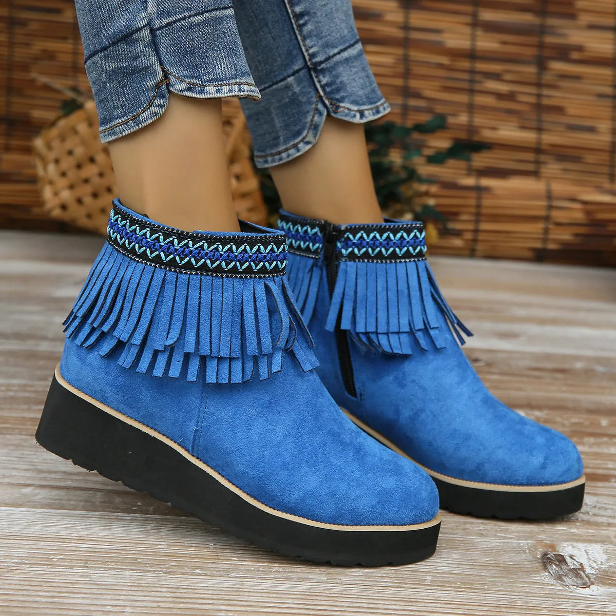 Women's dark brown suede wedge ankle boot with side zip, tassel, and thick rubber sole.