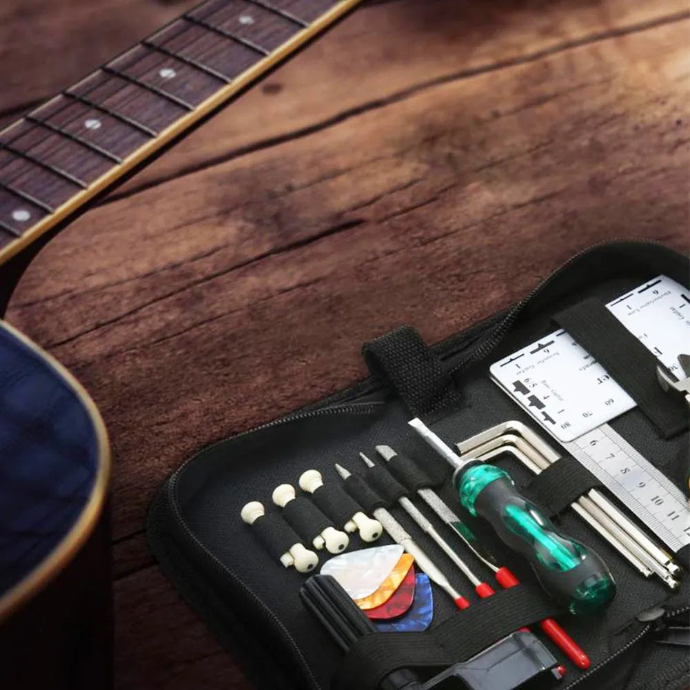 Black plastic and metal guitar repair tool kit for guitar, bass, mandolin, banjo.