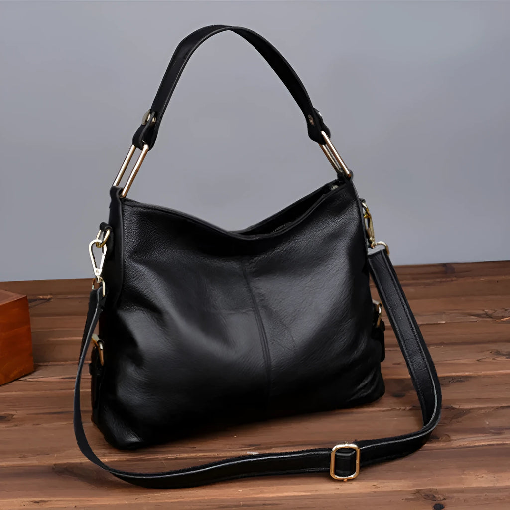 Genuine leather vertical square crossbody bag showing internal phone and document pockets
