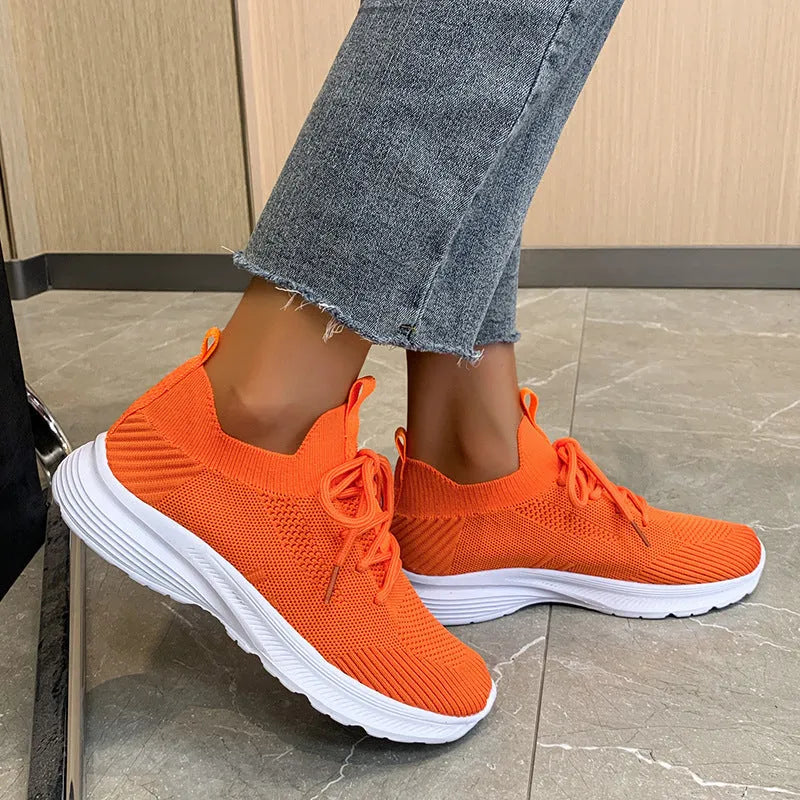 Women's mesh running shoes in creamy white with English muffin heel detail