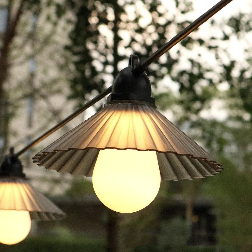 Outdoor flower-shaped LED string lights with IP65 rating for garden and patio use.