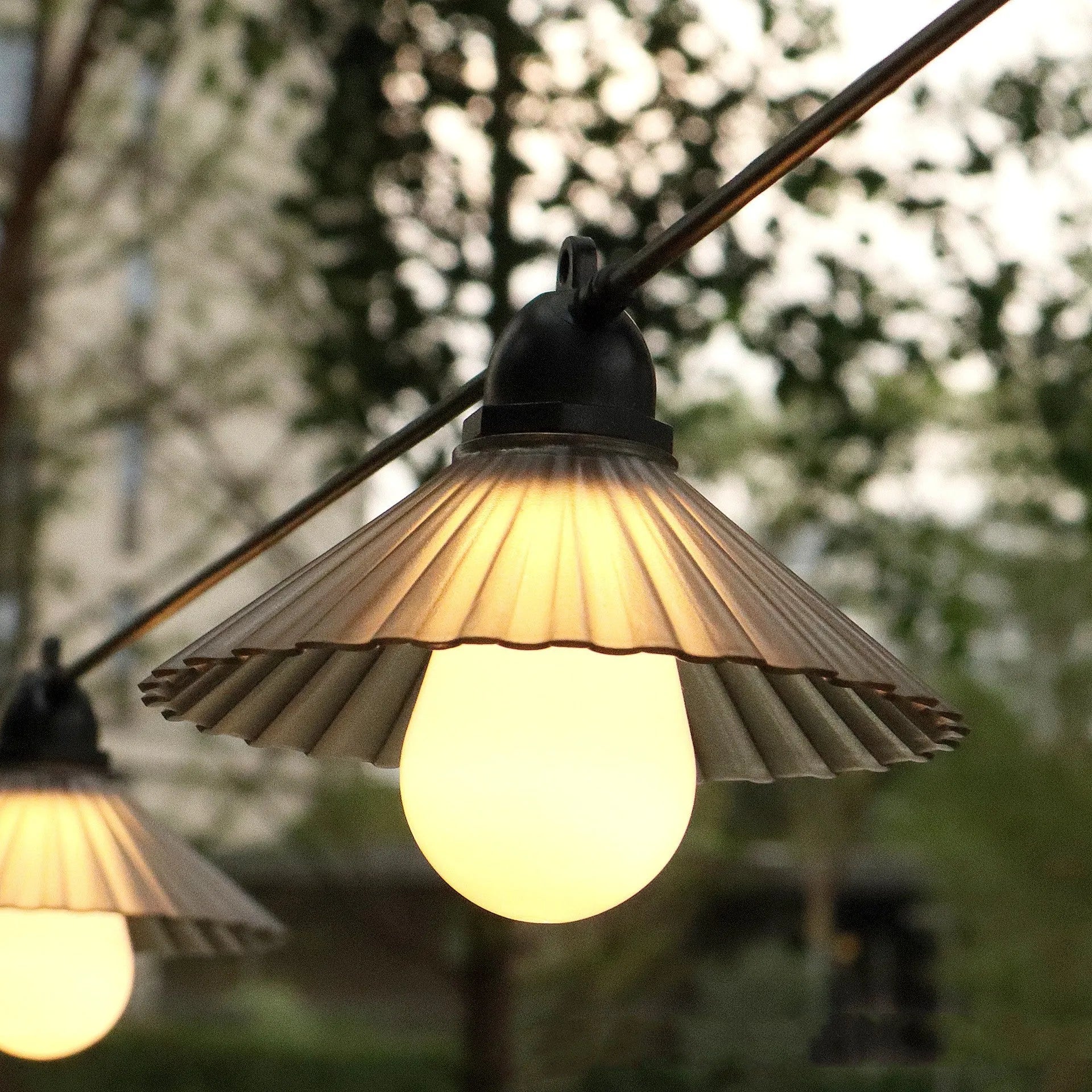 Outdoor flower-shaped LED string lights with IP65 rating for garden and patio use.