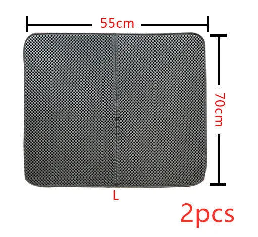 Double layer EVA cat litter mat in black with textured surface, placed under a litter box to trap debris