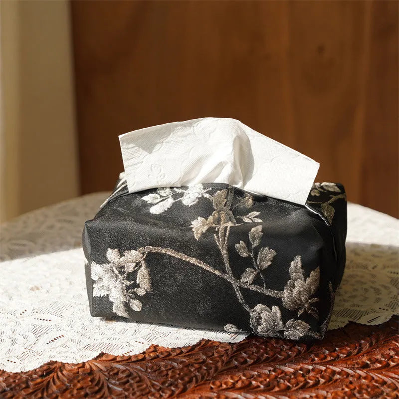 Chinese brocade fabric tissue box with embroidered white plum pattern, approximately 17 cm wide