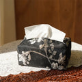 Chinese brocade fabric tissue box with embroidered white plum pattern, approximately 17 cm wide