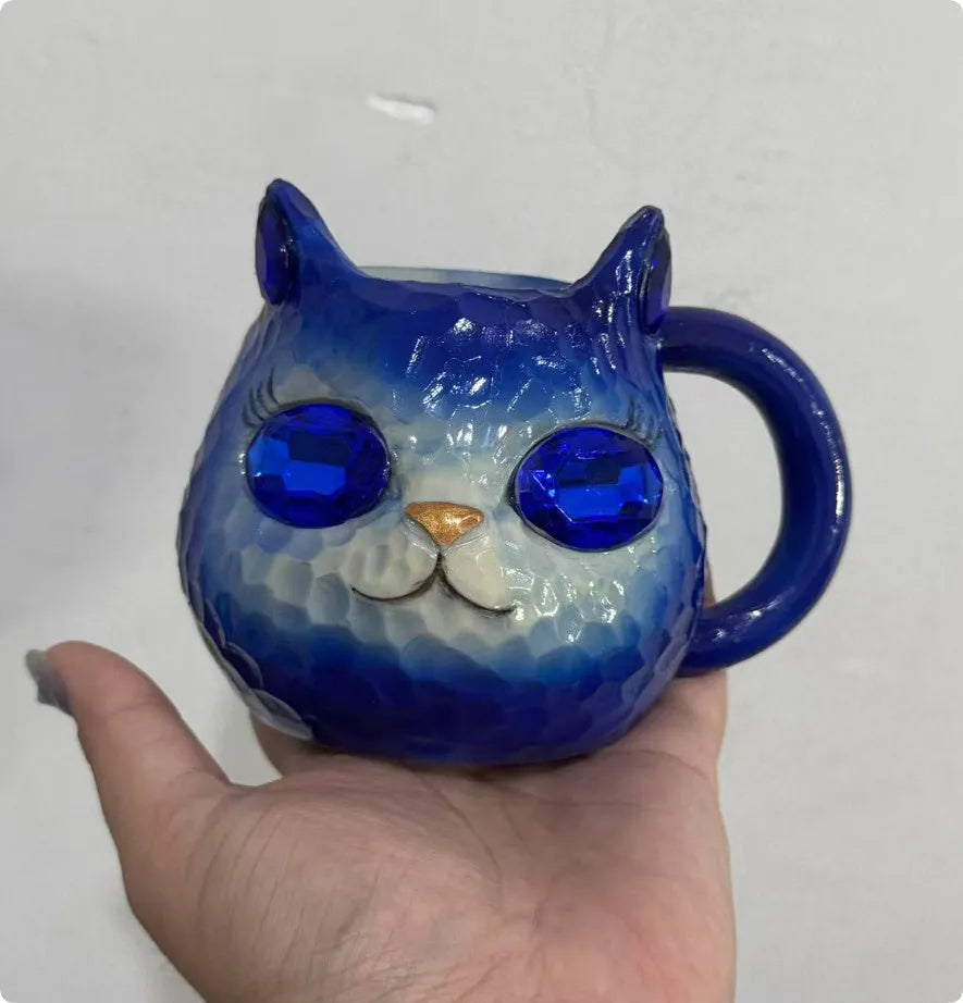 Crystal Earth Cat Cup resin craft decorative object in purple, green, blue, or pink colours.