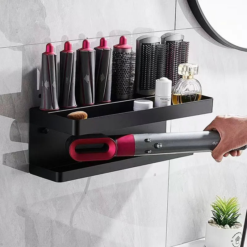 Aluminium punch-free bathroom storage rack holding hair curlers in black finish