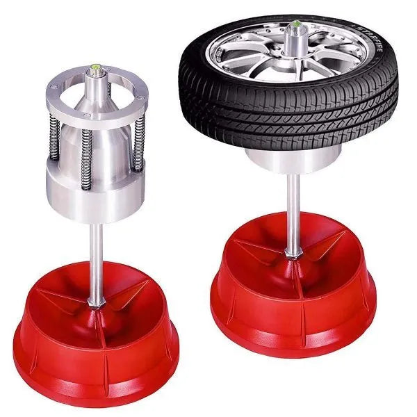 Portable aluminium hub balancer with enamel base for wheel balancing.