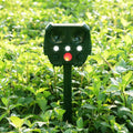 Green solar ultrasonic animal repeller unit with solar panel on top.