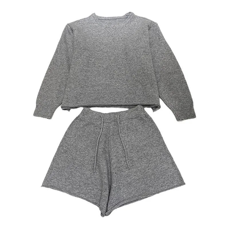 Women's knitted two-piece set showing long sleeve sweater with wide leg shorts in oatmeal colour
