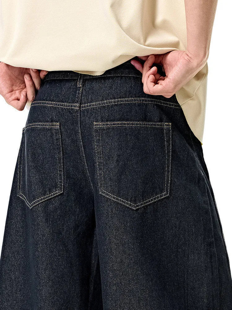 Men's wide leg denim trousers in original cow colour showing mid-waist design and cotton fabric
