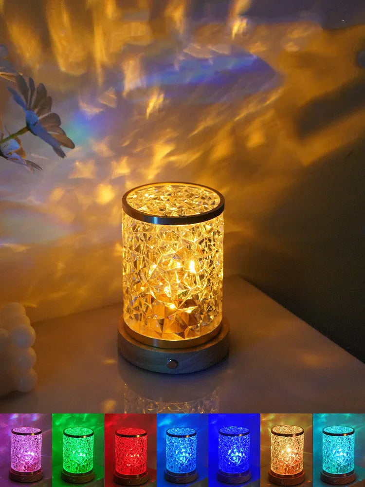 Modern rotating water ripple night light with acrylic body and solid wood base on a surface.