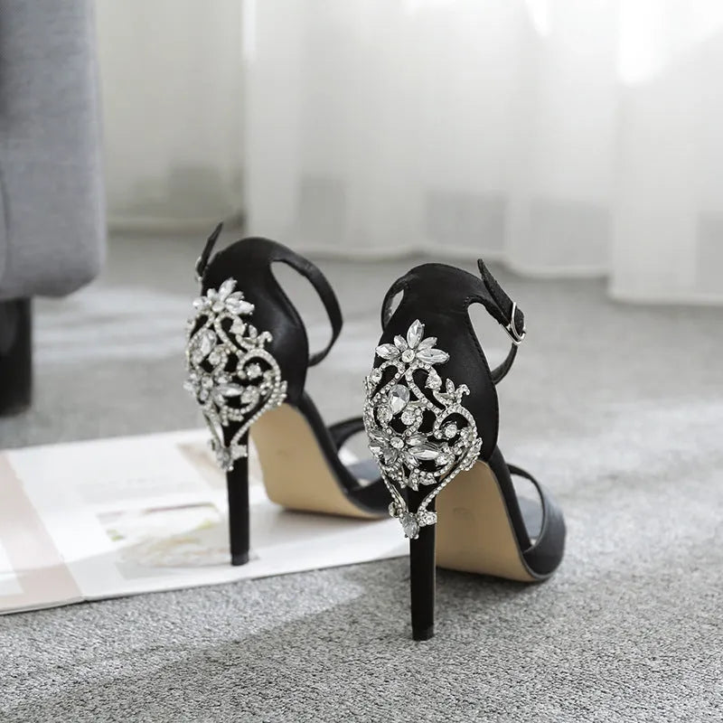 Black suede women's high heel shoes with rhinestone decorations and a fish mouth toe.