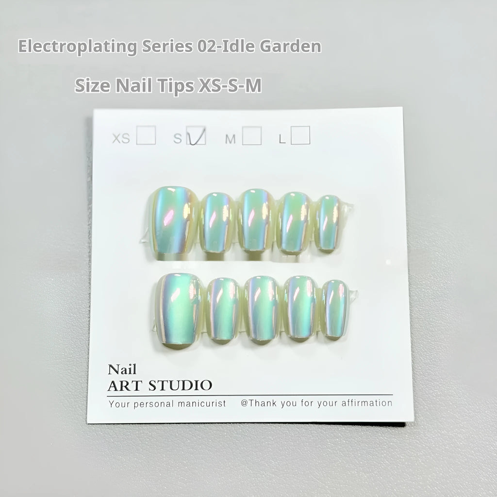 Set of electroplated Cat's Eye false nails in Aurora style showing short ladder shapes in XS, S, and M sizes.