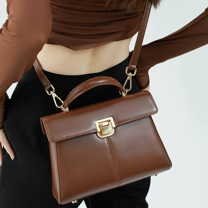 Women's genuine leather shoulder bag with vachette clasp in black horizontal square design