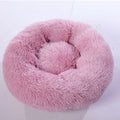 Plush pet nest in apricot colour on floor, soft cloth circular dog bed 40cm diameter indoor use