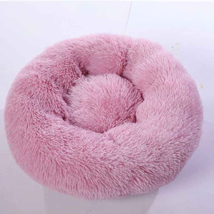 Plush pet nest in apricot colour on floor, soft cloth circular dog bed 40cm diameter indoor use
