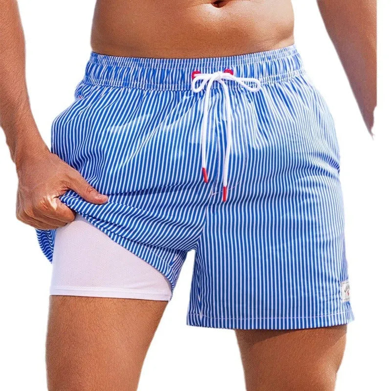 Men's loose swimming trunks with elastic waistband in multiple colour patterns including floral and aquatic designs