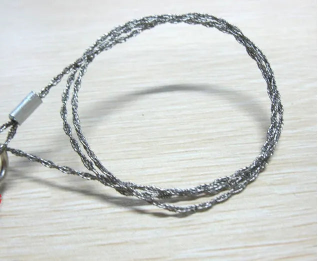 Survival wire saw with stainless steel blade and finger loops, showing 55cm length and pull ring