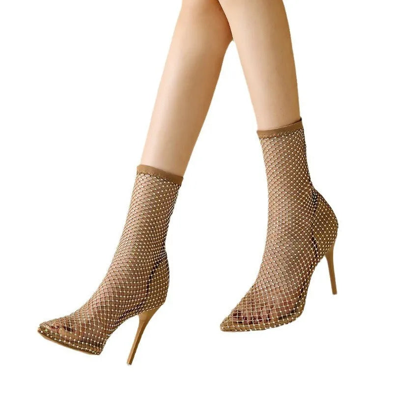 Gold women's high heel sandals with pointed stiletto toe and mesh upper.
