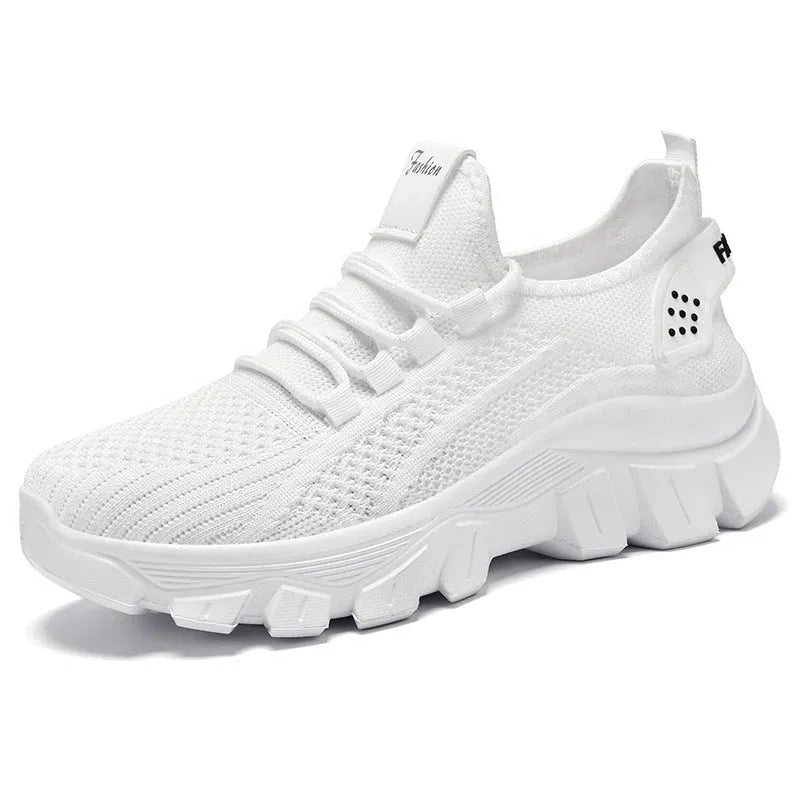 Women's white Flyknit running sneakers with thick PVC sole and lace-up front