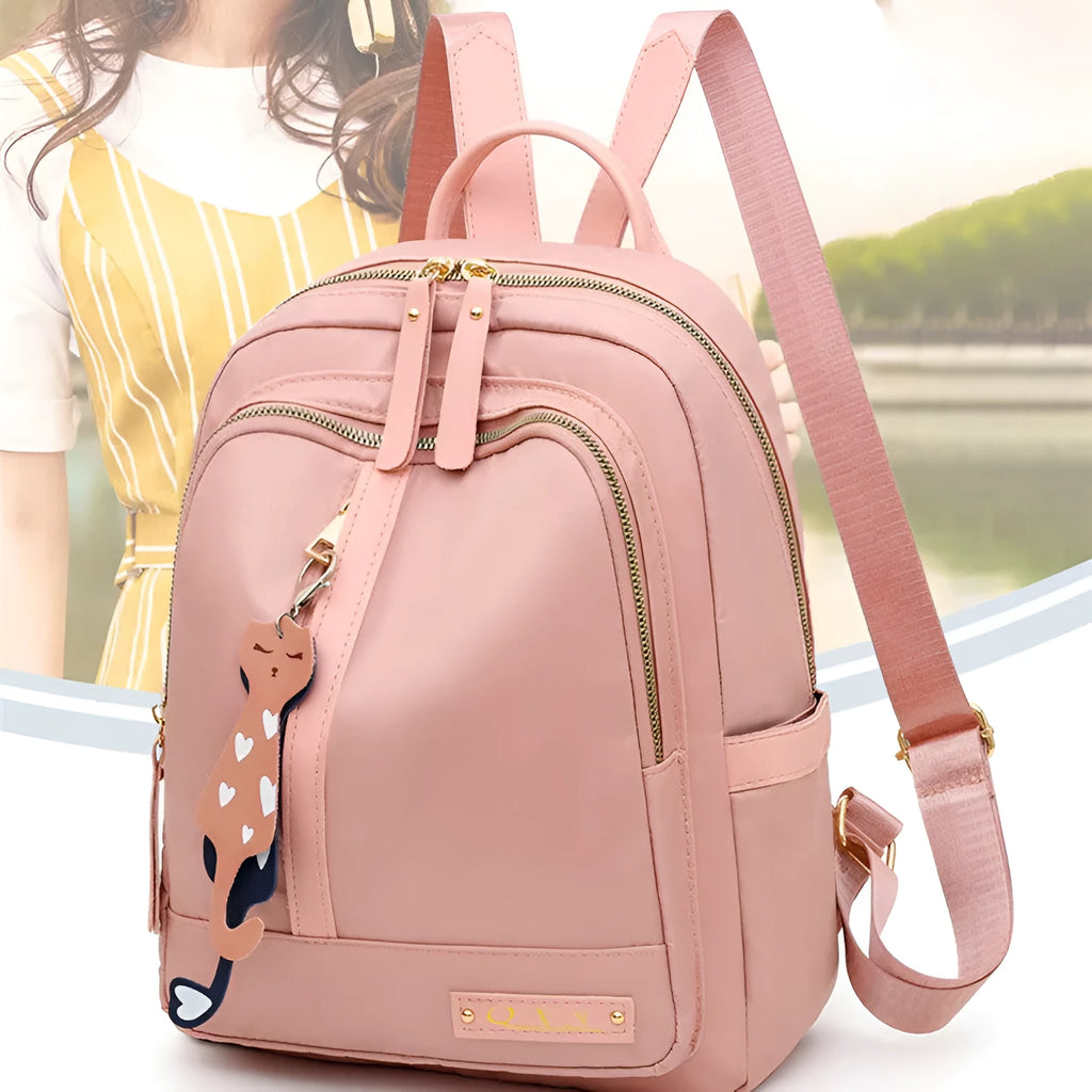 Women's black nylon casual backpack with double shoulder straps showing internal compartments and waterproof features