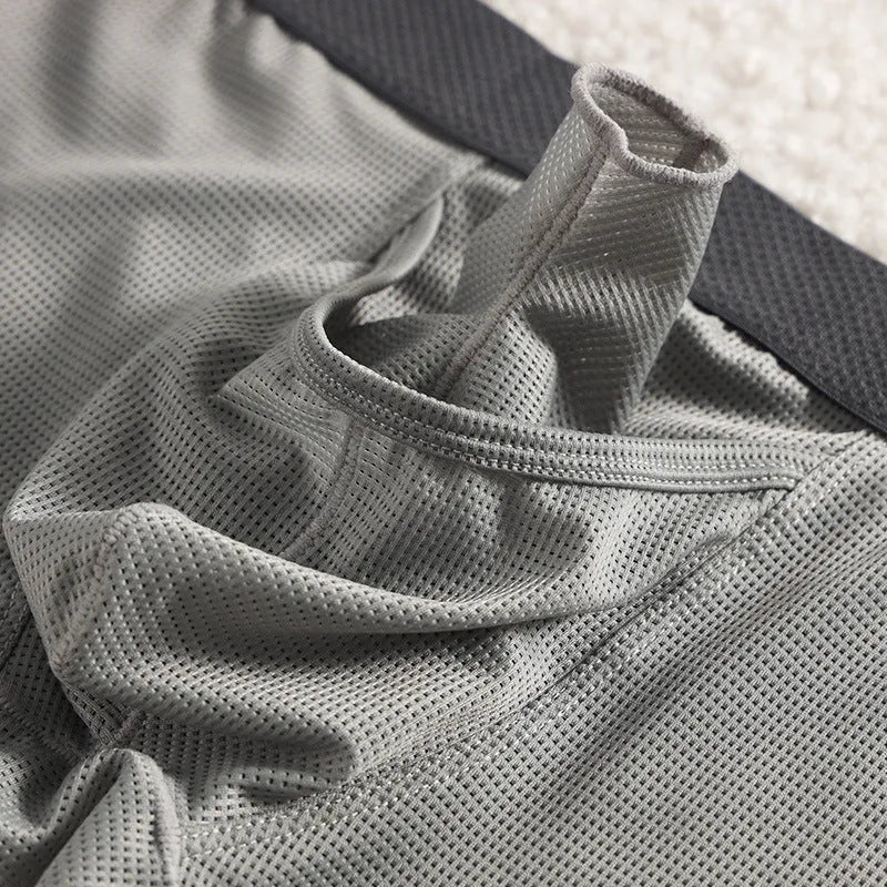 Men's black ice silk boxer shorts with a low waistband and mesh fabric panels.