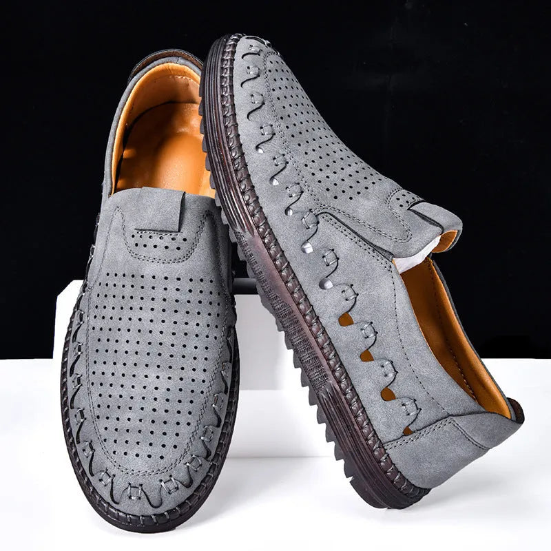 Men's brown slip-on casual shoes with round toe, flat heel, and visible sewing line details.