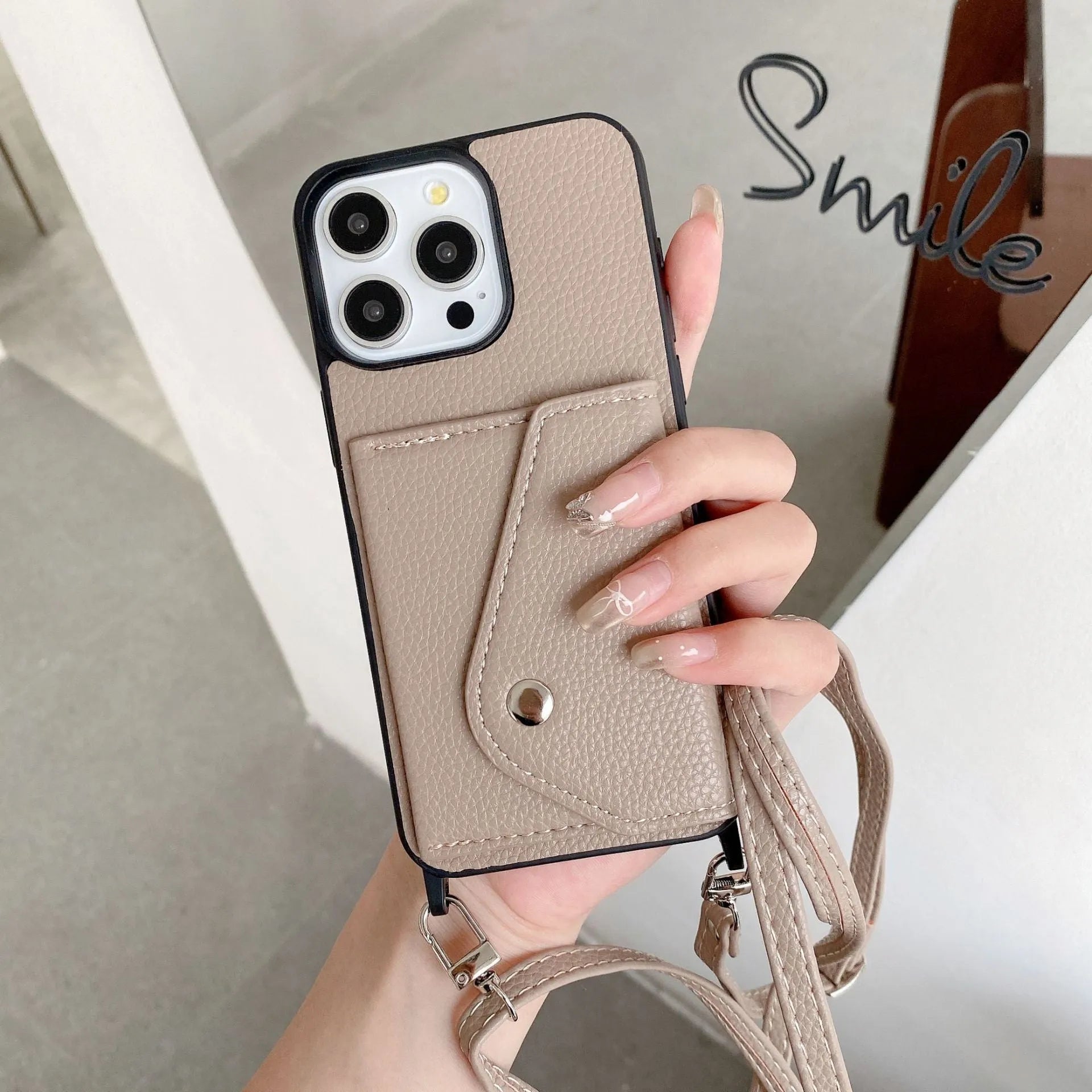 Lychee pattern imitation leather phone case with crossbody strap and triangle card holder for iPhone 14