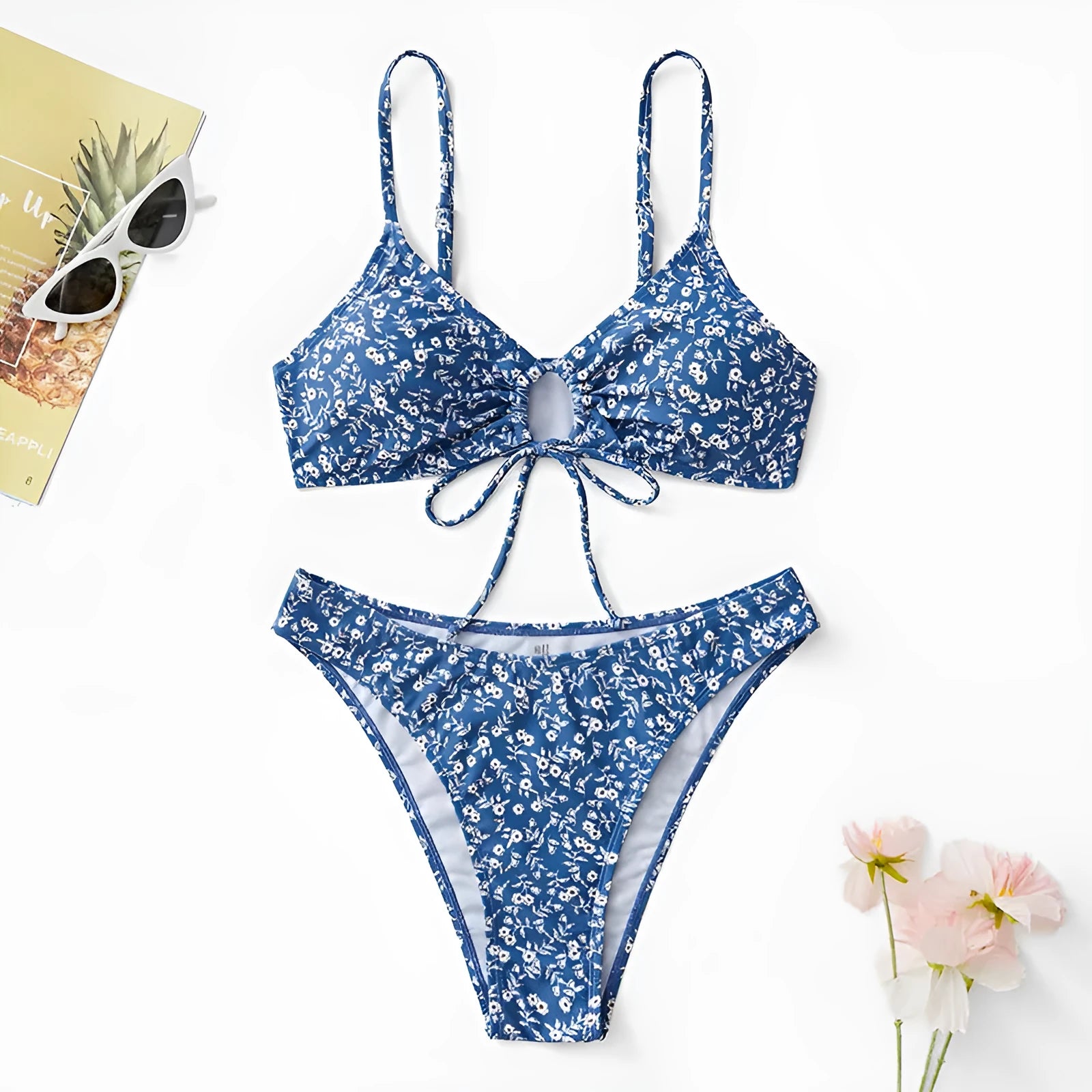 Blue three-piece swimsuit set consisting of a top and shorts, made from polyester fabric.