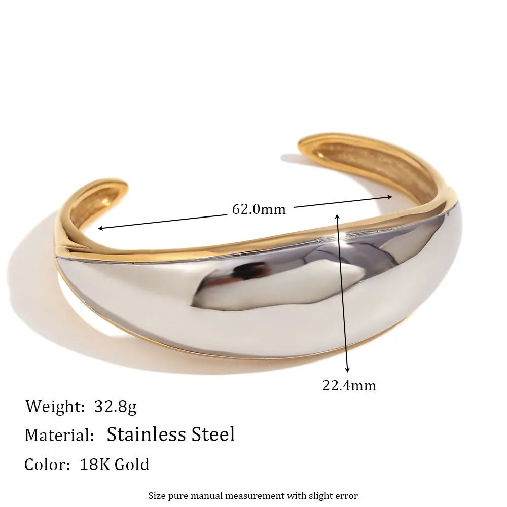 Women's geometric gold stainless steel jewellery set showing earrings, bracelet and necklace