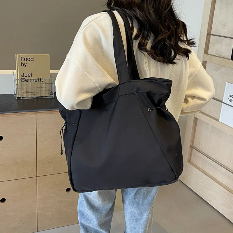 Soft Oxford cloth folding shoulder tote bag shown in available colour options
