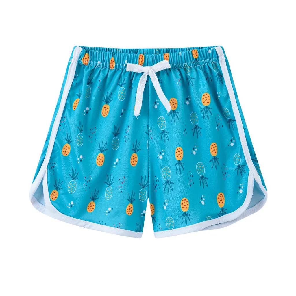 Children's polyester beach shorts in various colours and patterns including stripes, prints and solid options