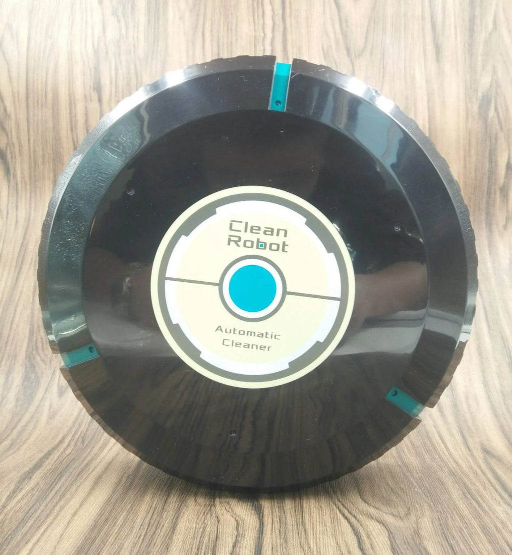 Black AC automatic sweeping robot vacuum cleaner on a wooden floor.