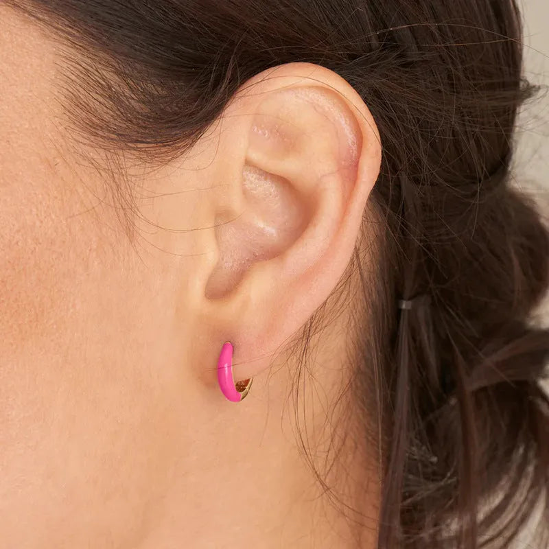 Geometric epoxy resin earrings with dripping oil colour technique showing oval curves and integrated rings