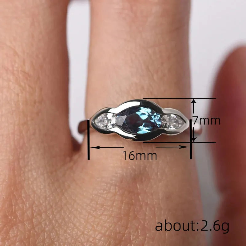 Geometric ellipse women's ring with inlaid zircon stones in Q941 white gold plating