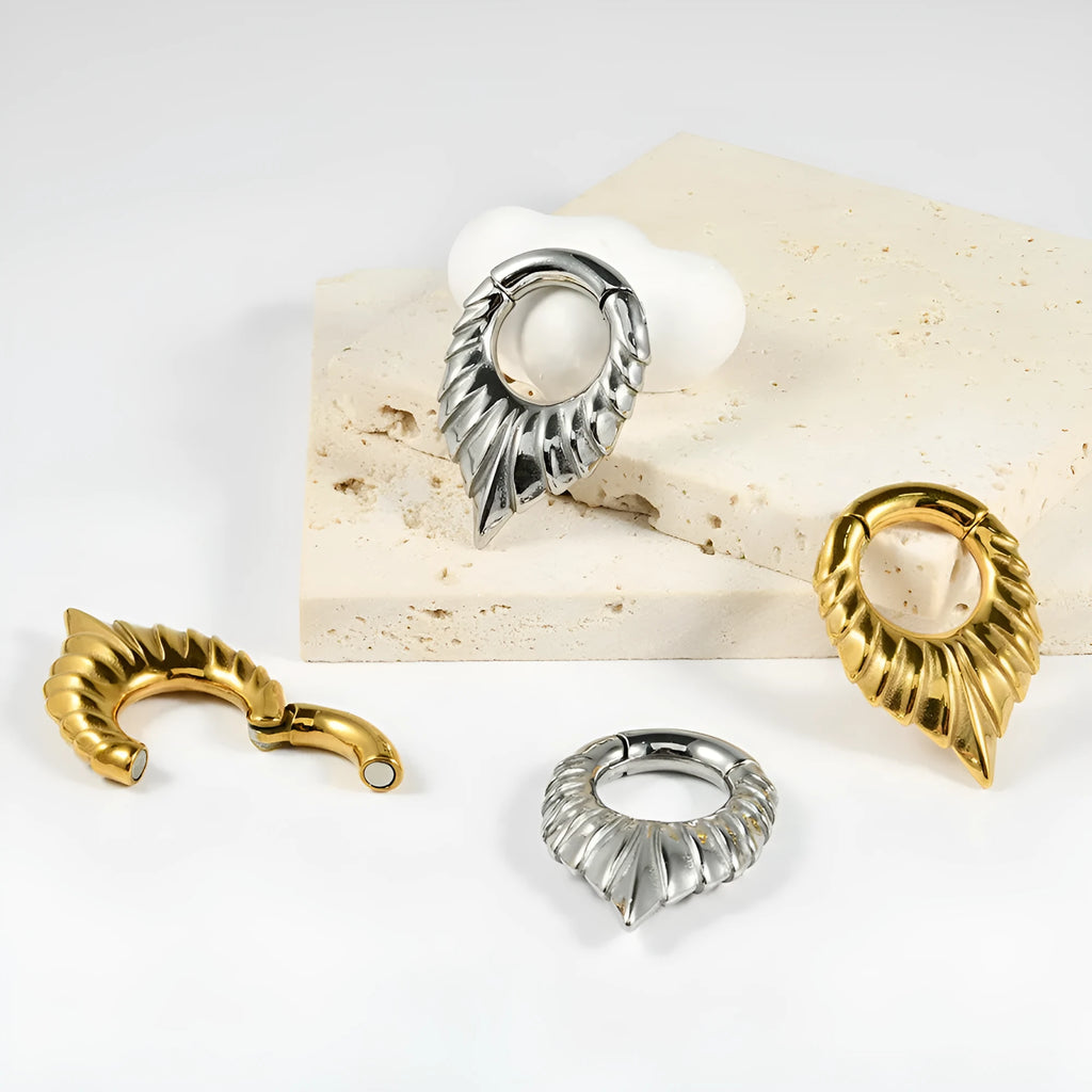 Stainless steel drop-shaped ear extender with totem design for stretched earlobes in style variations