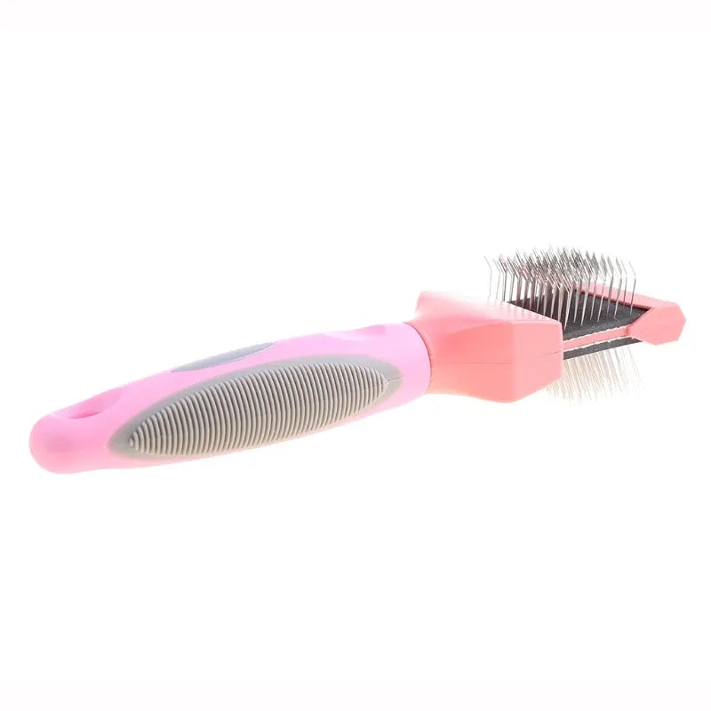 Blue double-sided pet brush with stainless steel pins and ergonomic handle on a white background.