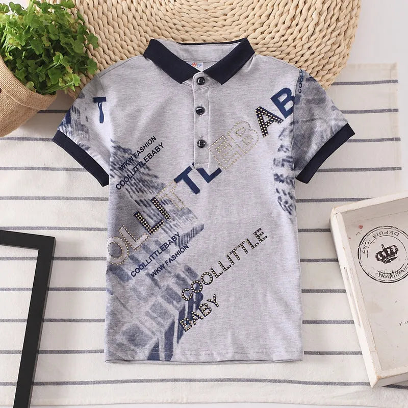 Boys short sleeve cotton T-shirt in navy blue with a lapel collar, laid flat.