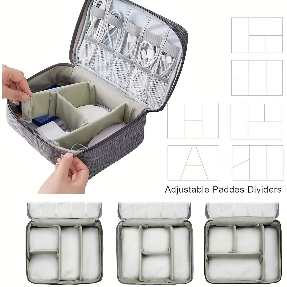 Black waterproof electronics organiser bag open, showing mesh pockets, elastic loops and removable dividers.