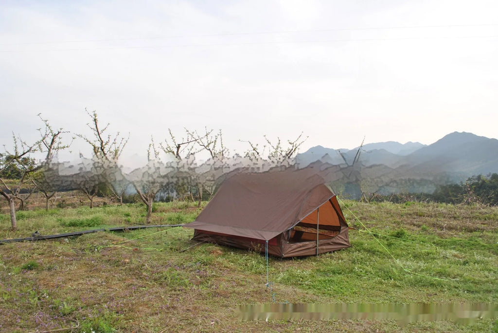 Brown or white A-line hiking tent without poles, supported by hiking canes